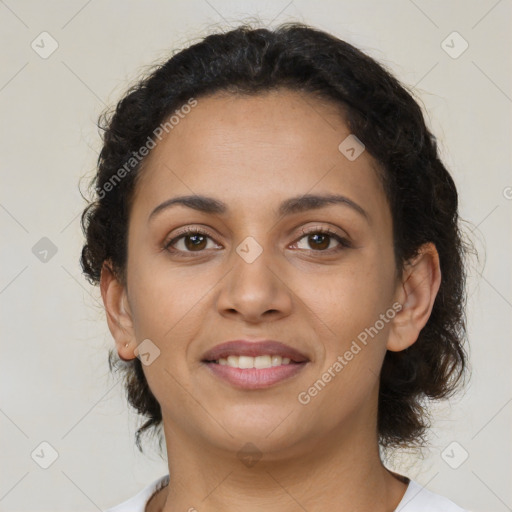 Joyful latino young-adult female with medium  brown hair and brown eyes