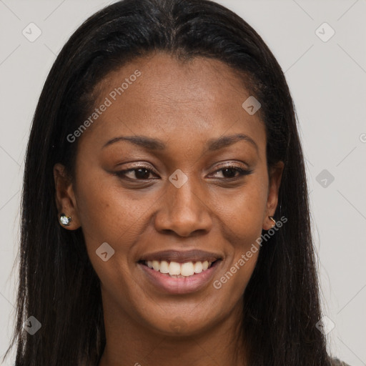 Joyful black young-adult female with long  brown hair and brown eyes