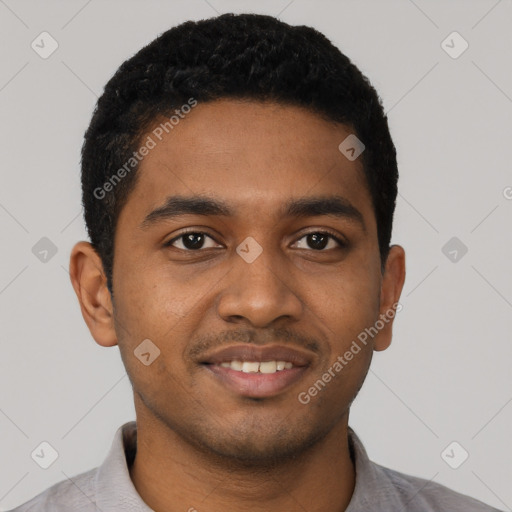 Joyful black young-adult male with short  black hair and brown eyes