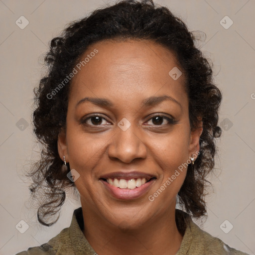 Joyful black adult female with medium  brown hair and brown eyes