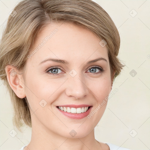 Joyful white young-adult female with medium  brown hair and green eyes