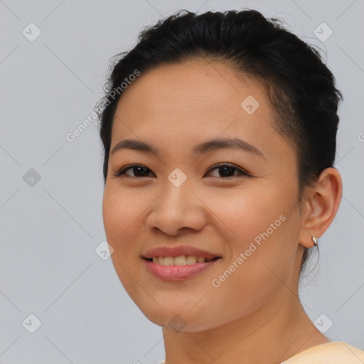 Joyful asian young-adult female with short  brown hair and brown eyes