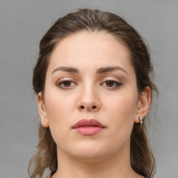 Neutral white young-adult female with medium  brown hair and brown eyes