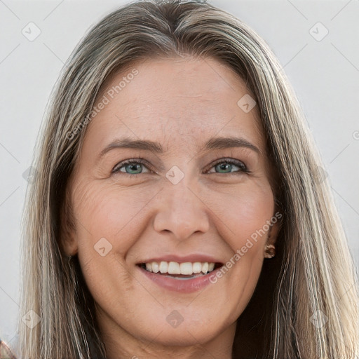 Joyful white young-adult female with long  brown hair and grey eyes