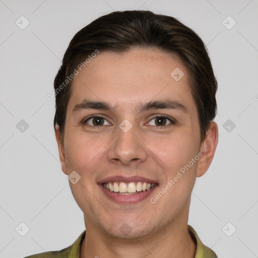 Joyful white young-adult male with short  brown hair and brown eyes