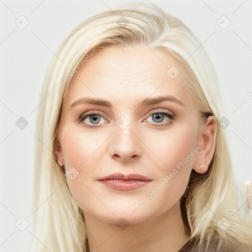 Joyful white young-adult female with long  brown hair and blue eyes