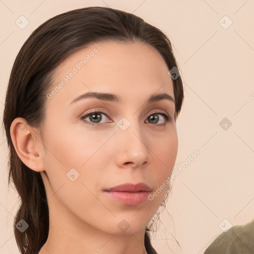 Neutral white young-adult female with long  brown hair and brown eyes