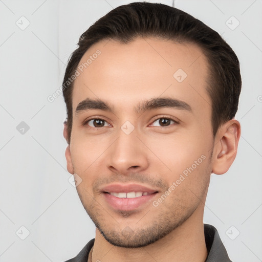 Joyful white young-adult male with short  brown hair and brown eyes