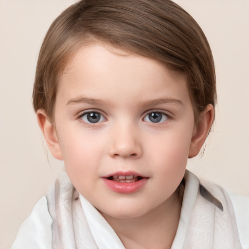 Joyful white child female with short  brown hair and grey eyes