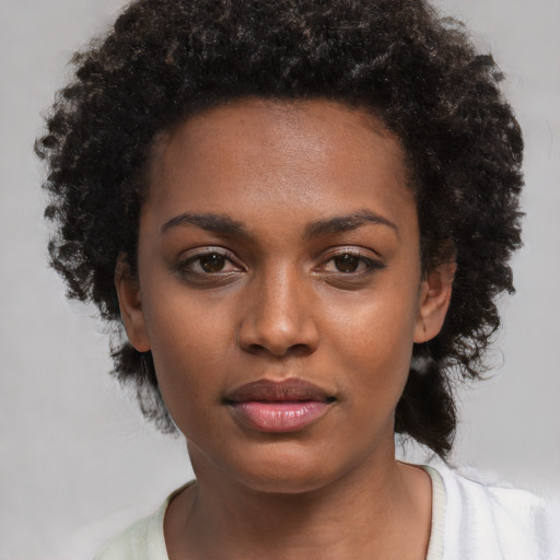 Neutral black young-adult female with short  black hair and brown eyes
