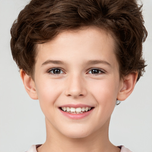 Joyful white child male with short  brown hair and brown eyes