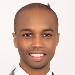 Joyful black young-adult male with short  brown hair and brown eyes