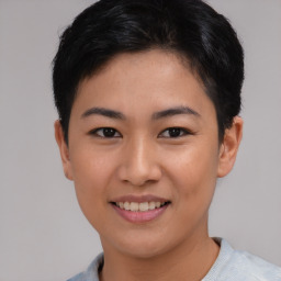 Joyful asian young-adult female with short  black hair and brown eyes