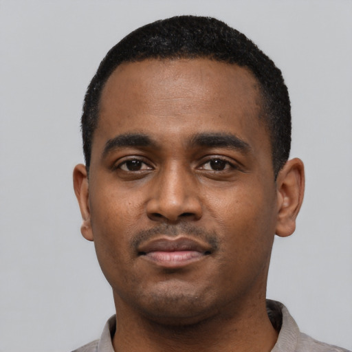 Neutral black young-adult male with short  black hair and brown eyes