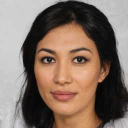 Joyful asian young-adult female with medium  black hair and brown eyes