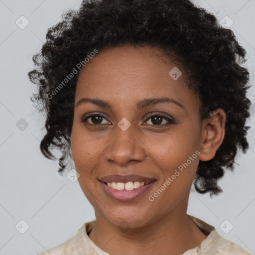 Joyful black adult female with short  brown hair and brown eyes