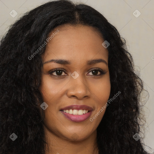 Joyful black young-adult female with long  brown hair and brown eyes