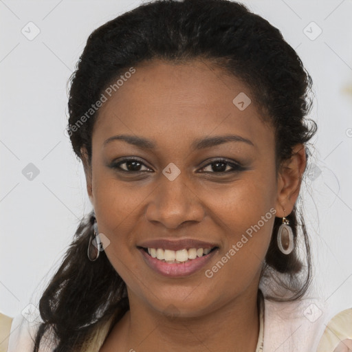 Joyful black young-adult female with long  brown hair and brown eyes