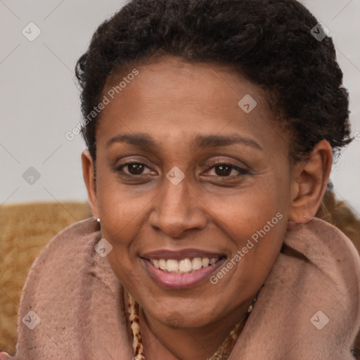 Joyful black adult female with short  brown hair and brown eyes