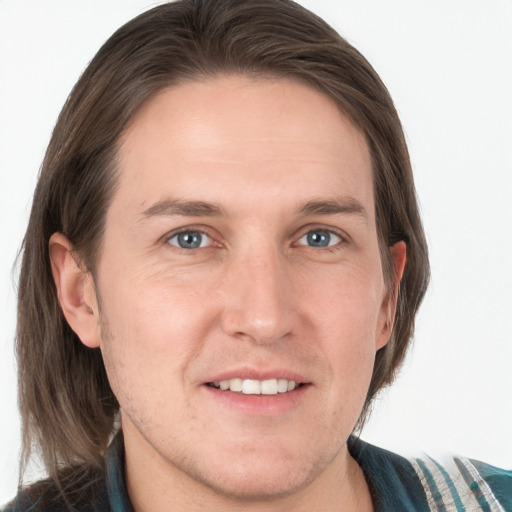 Joyful white young-adult male with medium  brown hair and grey eyes