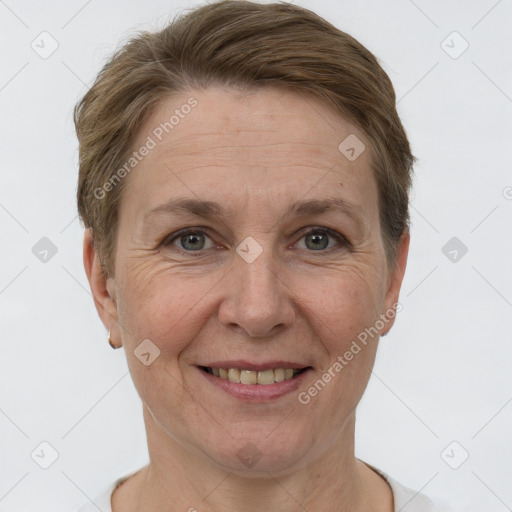 Joyful white adult female with short  brown hair and grey eyes