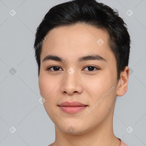 Joyful asian young-adult male with short  black hair and brown eyes