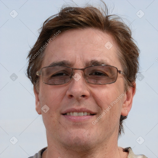 Joyful white adult male with short  brown hair and grey eyes