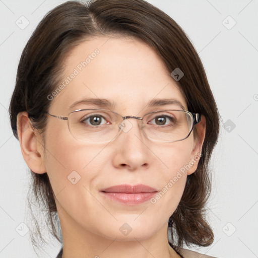 Joyful white adult female with medium  brown hair and grey eyes