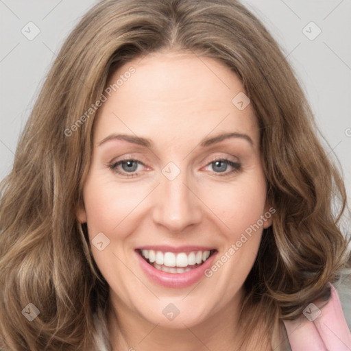 Joyful white young-adult female with long  brown hair and green eyes