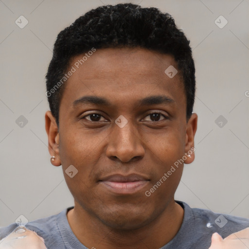 Joyful black young-adult male with short  black hair and brown eyes