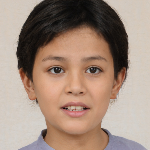Joyful asian child female with short  brown hair and brown eyes