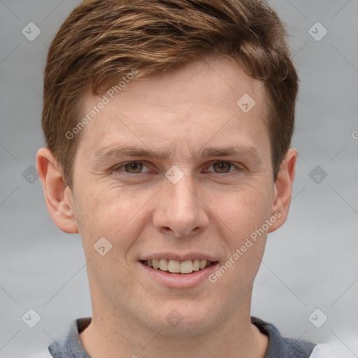 Joyful white adult male with short  brown hair and grey eyes