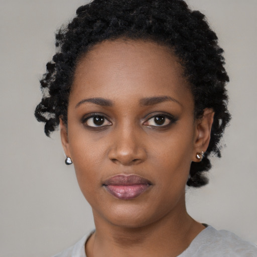 Neutral black young-adult female with short  black hair and brown eyes
