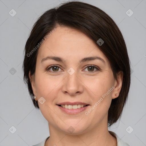 Joyful white adult female with medium  brown hair and brown eyes