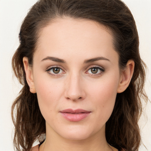 Joyful white young-adult female with long  brown hair and green eyes