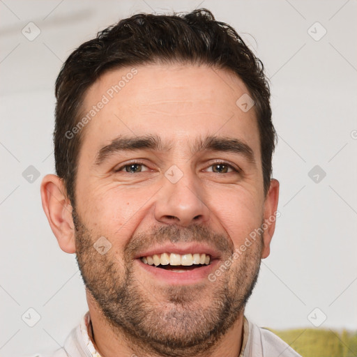 Joyful white adult male with short  brown hair and brown eyes