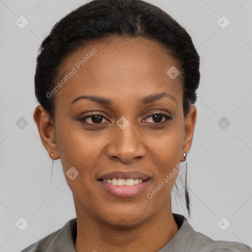 Joyful black young-adult female with short  brown hair and brown eyes