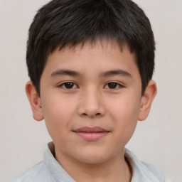 Joyful white child male with short  brown hair and brown eyes