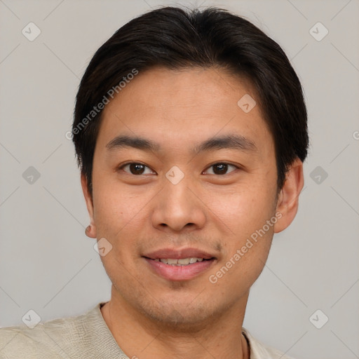 Joyful asian young-adult male with short  brown hair and brown eyes