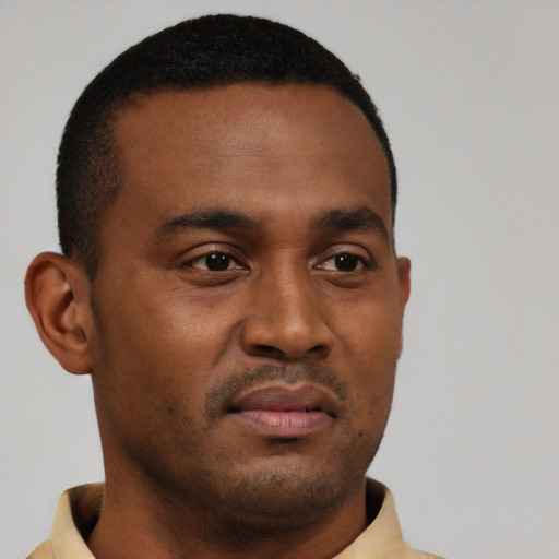 Neutral black young-adult male with short  brown hair and brown eyes
