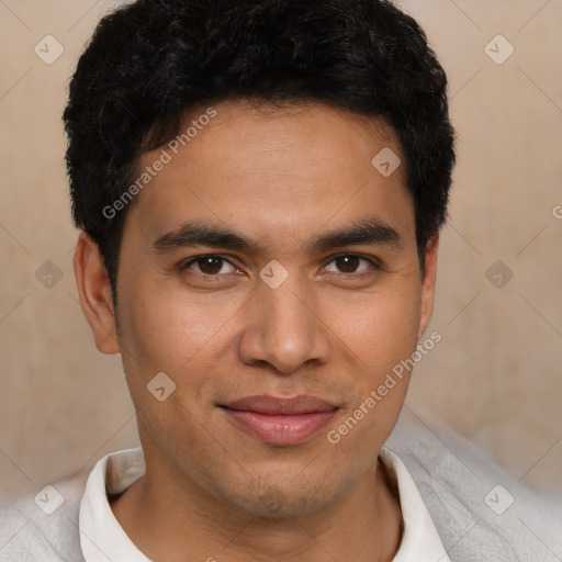 Joyful latino young-adult male with short  brown hair and brown eyes