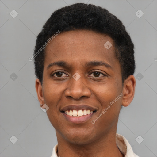 Joyful black young-adult male with short  brown hair and brown eyes