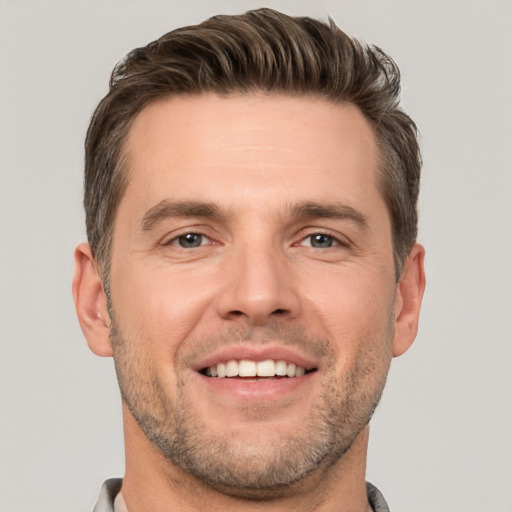 Joyful white young-adult male with short  brown hair and brown eyes