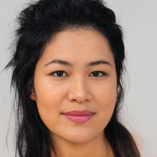 Joyful asian young-adult female with long  brown hair and brown eyes