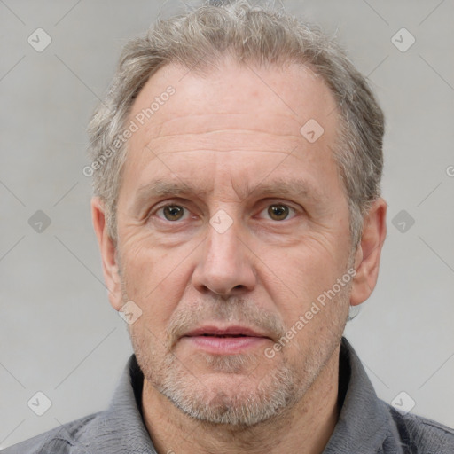 Neutral white middle-aged male with short  gray hair and grey eyes