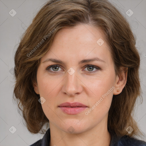 Joyful white adult female with medium  brown hair and grey eyes