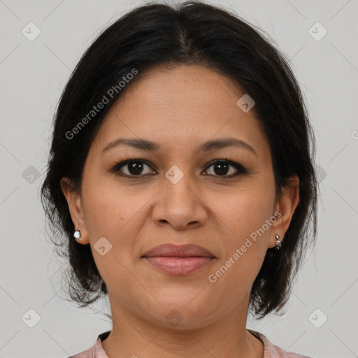 Joyful latino adult female with medium  brown hair and brown eyes