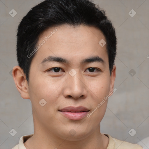 Joyful asian young-adult male with short  brown hair and brown eyes