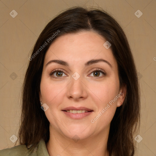 Joyful white adult female with medium  brown hair and green eyes