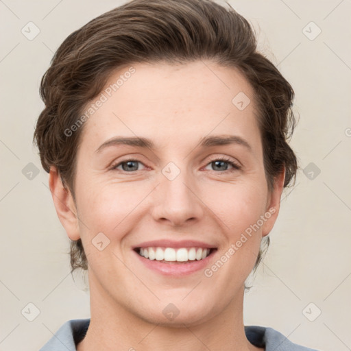 Joyful white young-adult female with short  brown hair and grey eyes